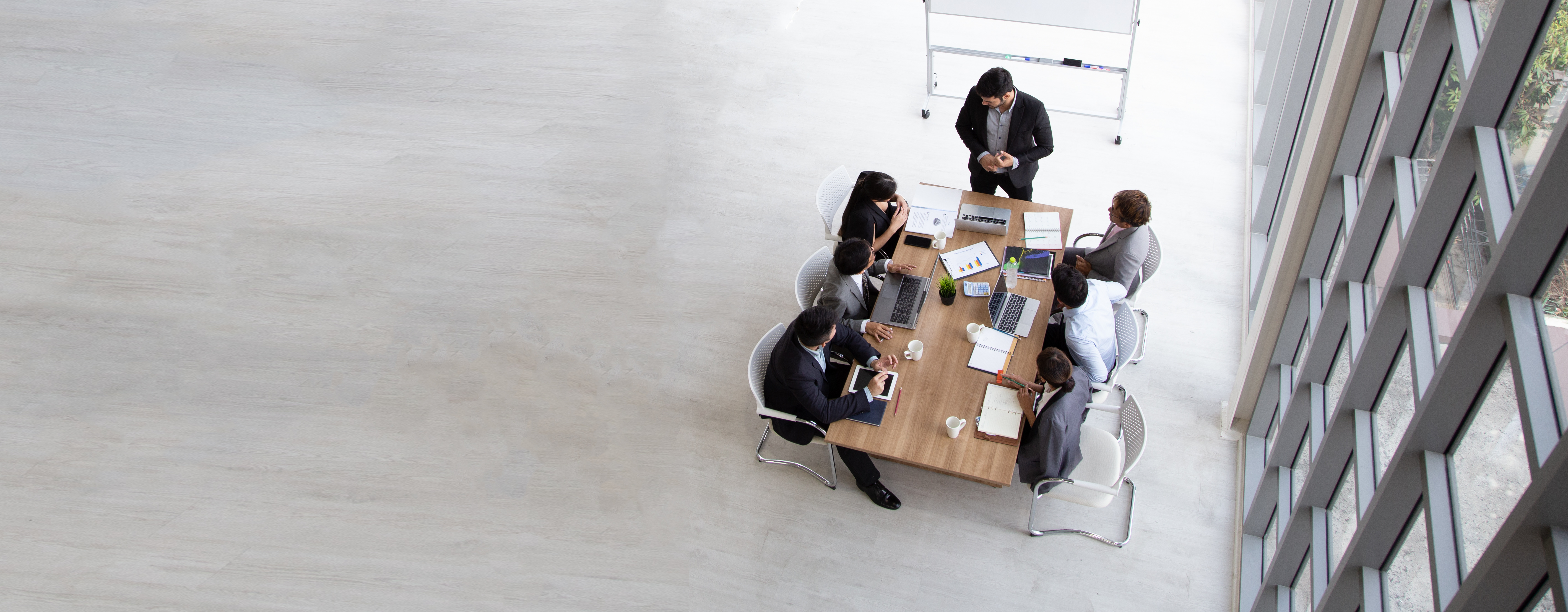 Professionals collaborating around a meeting table